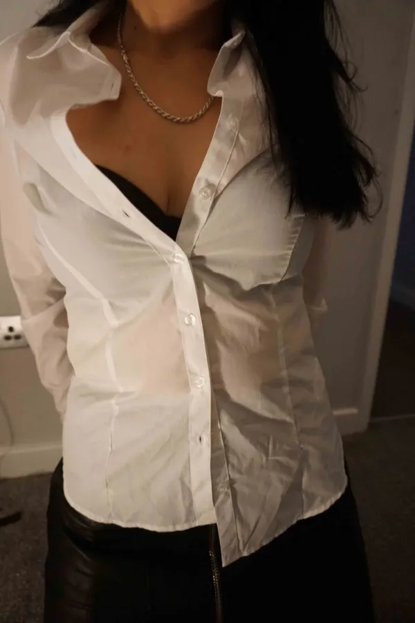 Hanna wearing a white shirt