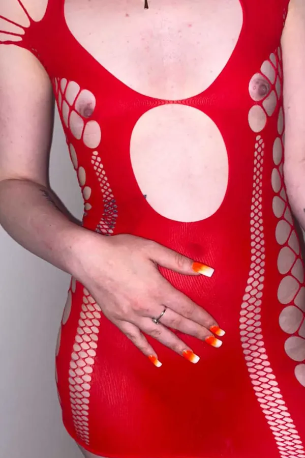 Kayleigh wearing a red bodysuit